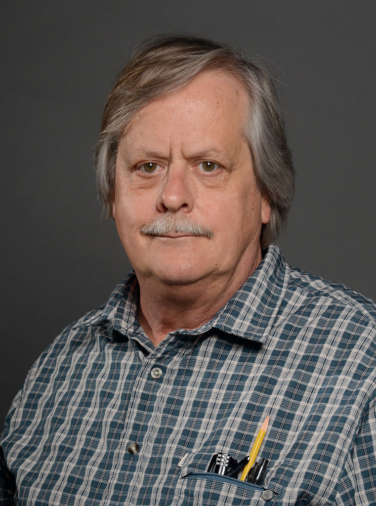 portrait of John Schneller